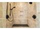 Walk in shower with beautiful tile surround, a built in seat and dual shower heads at 3728 Westbury Lake Dr, Raleigh, NC 27603