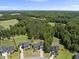 Aerial view of the neighborhood, with houses and wooded area at 374 Heart Pine Dr, Wendell, NC 27591
