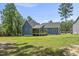 Back exterior of the house with a porch and a large yard at 374 Heart Pine Dr, Wendell, NC 27591