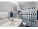Bathroom featuring a modern vanity, mirror, and shower with decorative curtain at 374 Heart Pine Dr, Wendell, NC 27591