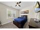 Cozy bedroom with a ceiling fan, TV, and a picturesque window view at 374 Heart Pine Dr, Wendell, NC 27591