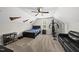 Finished bedroom featuring a bed, nightstand, exercise equipment, and sofa at 374 Heart Pine Dr, Wendell, NC 27591