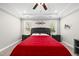 Primary bedroom featuring tray ceilings, and two windows at 374 Heart Pine Dr, Wendell, NC 27591