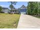 Two story home with a two-car garage and long drive way at 374 Heart Pine Dr, Wendell, NC 27591