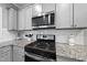 Kitchen featuring stainless steel appliances, granite countertops, and white subway tile backsplash at 374 Heart Pine Dr, Wendell, NC 27591