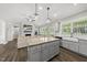 Open concept kitchen and living room with granite countertops and fireplace at 374 Heart Pine Dr, Wendell, NC 27591