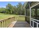 Covered porch with wood floor and railing at 374 Heart Pine Dr, Wendell, NC 27591