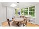 Bright dining area with large windows and views of the backyard at 3806 Lochnora Pkwy, Durham, NC 27705