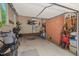 Well-lit garage with ample storage, exposed brick wall, and room for parking at 3806 Lochnora Pkwy, Durham, NC 27705