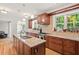 Spacious kitchen with custom wood cabinets, granite countertops, and stainless steel appliances at 3806 Lochnora Pkwy, Durham, NC 27705