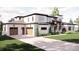 Stunning two-story home featuring a three-car garage, modern design, and manicured lawn at 4 Rainforest Pl, Apex, NC 27523