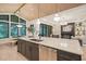 Modern kitchen with marble countertops, stainless steel appliances, and an island with seating at 4 Rainforest Pl, Apex, NC 27523