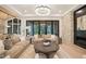 Inviting living room with stone fireplace, modern lighting, and a comfortable seating area at 4 Rainforest Pl, Apex, NC 27523