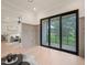 Bright and airy room featuring hardwood floors and a sliding glass doors leading to an outdoor patio at 4 Rainforest Pl, Apex, NC 27523