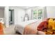 Bright bedroom featuring neutral carpet, a window, and a closet at 4001 Pin Oak Rd, Raleigh, NC 27604