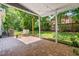 An inviting covered patio with brick pavers offers a comfortable outdoor living space at 4001 Pin Oak Rd, Raleigh, NC 27604
