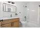Bathroom featuring a wood vanity, white countertop, framed mirror, and glass enclosed shower at 411 Bon Air Ave, Durham, NC 27704