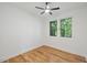 Bedroom with hardwood floors, a ceiling fan, and large windows for plenty of natural light at 411 Bon Air Ave, Durham, NC 27704