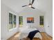 Bright bedroom featuring vaulted ceilings, hardwood floors, and large windows for plenty of natural light at 411 Bon Air Ave, Durham, NC 27704