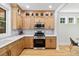Modern kitchen with stainless steel appliances, sleek cabinetry, and ample counter space at 411 Bon Air Ave, Durham, NC 27704