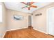 Hardwood floor bedroom with a ceiling fan and a view of a wall mount, offering comfort and convenience at 4536 Massey Rd, Zebulon, NC 27597