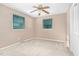Bright bedroom with carpet, complemented by two windows and a closet, creating a cozy atmosphere at 4536 Massey Rd, Zebulon, NC 27597