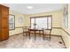 Inviting dining area with a large window and classic decor at 4536 Massey Rd, Zebulon, NC 27597