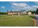 Fenced yard featuring a well-maintained lawn and a storage shed at 4536 Massey Rd, Zebulon, NC 27597