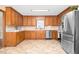 Well-equipped kitchen with stainless steel appliances and wood cabinetry at 4536 Massey Rd, Zebulon, NC 27597