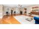 Bright living room featuring hardwood floors, stylish furnishings, and a view to the kitchen at 4536 Massey Rd, Zebulon, NC 27597