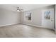 Light filled living room featuring vinyl flooring and multiple windows at 4610 Lemon Heights Dr, Sanford, NC 27332