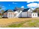 Backyard featuring a covered porch with white columns and a ceiling fan at 50 Farmstead Ct, Wendell, NC 27591