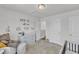 Cozy Bedroom with changing table, playful decor, and ample storage at 520 Oak Holly Ln, Zebulon, NC 27597