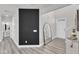 Welcoming entryway featuring a modern design, sleek flooring, and an arched mirror reflecting natural light at 520 Oak Holly Ln, Zebulon, NC 27597