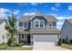 Charming two-story home featuring a two-car garage and a well-manicured lawn, perfect for families at 520 Oak Holly Ln, Zebulon, NC 27597