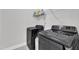 Laundry room featuring side by side appliances and shelf storage at 520 Oak Holly Ln, Zebulon, NC 27597