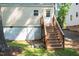 Exterior view featuring basement access and wooden stairs at 522 E Club Blvd, Durham, NC 27704