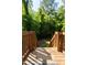 Wooden deck leading to a serene, wooded backyard area at 522 E Club Blvd, Durham, NC 27704