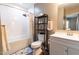Bathroom with a shower-tub combo, white vanity, and modern fixtures at 522 E Club Blvd, Durham, NC 27704