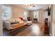 Inviting living room with hardwood floors, a comfortable sofa, and plenty of natural light at 522 E Club Blvd, Durham, NC 27704