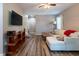 Inviting living room features a comfortable sofa, modern TV, and stylish wood-look floors at 522 E Club Blvd, Durham, NC 27704