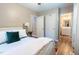 Comfortable main bedroom with a view to the ensuite bathroom, offering convenience and privacy at 522 E Club Blvd, Durham, NC 27704
