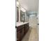 Bathroom with double vanity, framed mirrors, and shower at 550 Spring Flowers Dr, Cameron, NC 28326