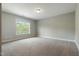Bright bedroom with a large window offering abundant natural light and neutral-toned walls at 550 Spring Flowers Dr, Cameron, NC 28326