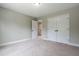 A bedroom with carpet, light-colored walls, and a closet with double doors at 550 Spring Flowers Dr, Cameron, NC 28326