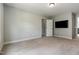 Spacious bedroom featuring neutral paint, plush carpeting, and modern recessed lighting at 550 Spring Flowers Dr, Cameron, NC 28326