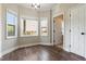 Charming breakfast nook features beautiful hardwood floors and an abundance of natural light from three windows at 550 Spring Flowers Dr, Cameron, NC 28326