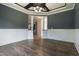 Dining room featuring neutral paint, hardwood floors, and wainscoting detail at 550 Spring Flowers Dr, Cameron, NC 28326