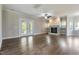 Spacious living room with a fireplace, French doors, and hardwood floors at 550 Spring Flowers Dr, Cameron, NC 28326