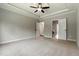 Spacious main bedroom with tray ceiling, recessed lighting, and multiple entryways at 550 Spring Flowers Dr, Cameron, NC 28326